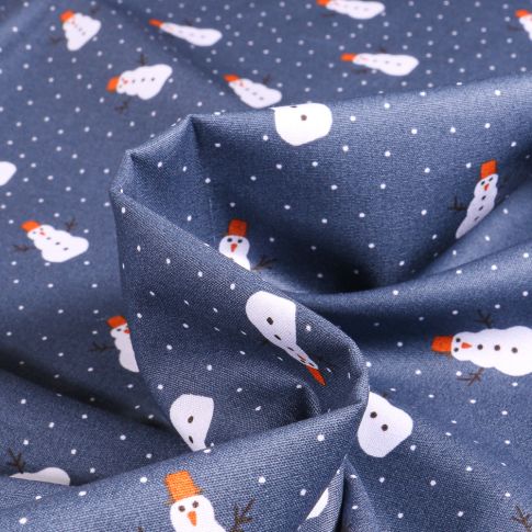 Tissu Coton imprimé Bonhomme de neige sur fond Bleu denim