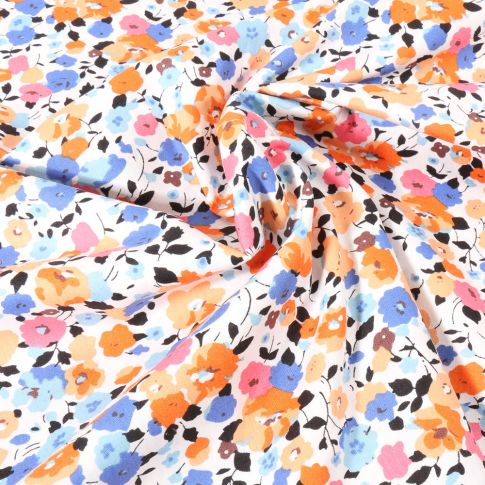 Tissu Voile de Coton imprimé Fleuris orangé et bleu sur fond Blanc
