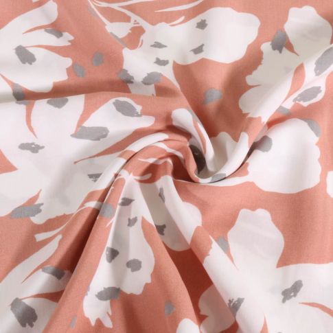 Tissu Viscose grandes fleurs blanches stylisées sur fond Rose nude