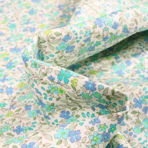 Tissu Coton popeline imprimé Florentine bleu sur fond Blanc cassé