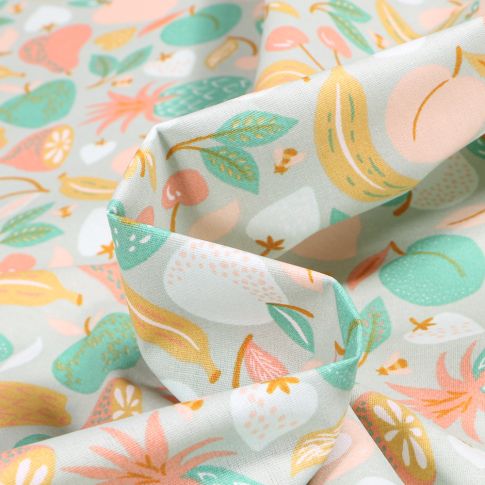 Tissu Coton enduit Fruits variés et colorés sur fond Vert pâle
