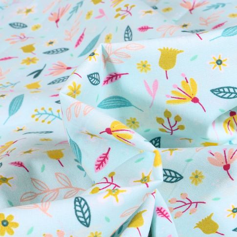 Tissu Coton imprimé Flower power sur fond Bleu ciel