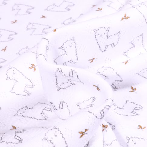Tissu Jersey ajouré Alpaga sur fond Blanc