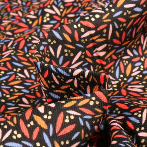 Tissu Velours milleraies Pétales Colorées sur fond Noir