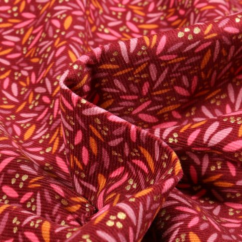 Tissu Velours milleraies Pétales Colorées sur fond Bordeaux