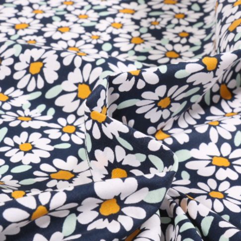 Tissu Coton enduit Alma Pâquerettes sur fond Bleu marine