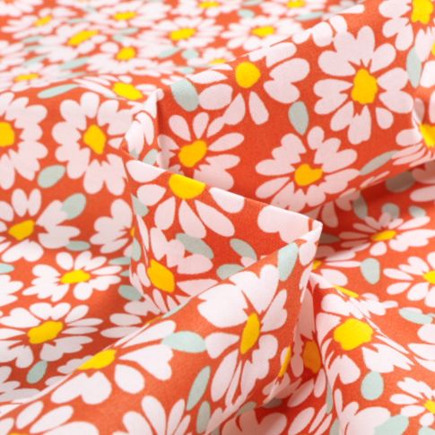 Tissu Coton enduit Alma Pâquerettes sur fond Orange