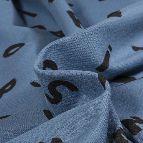 Tissu Sweat envers molletonné Alpha sur fond Bleu