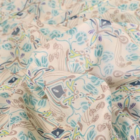 Tissu Mousseline Arabesques fleuris pastels sur fond Beige