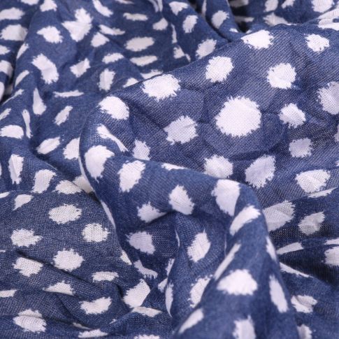 Tissu Maille légère Pois destructurés blanc sur fond Bleu denim
