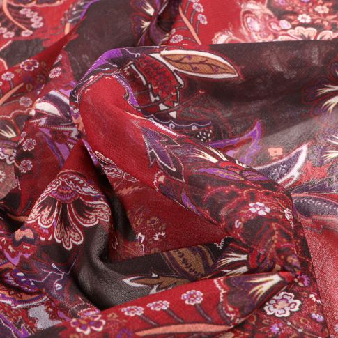 Tissu Mousseline Arabesques fleuris sur fond Bordeaux