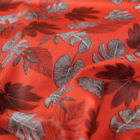 Tissu Coton imprimé Feuilles lilou sur fond Rouge