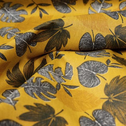 Tissu Coton imprimé Feuilles lilou sur fond Jaune