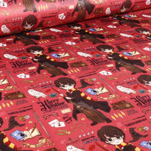 Tissus Velours d'ameublement sous licence Harry potter sur fond Grenat