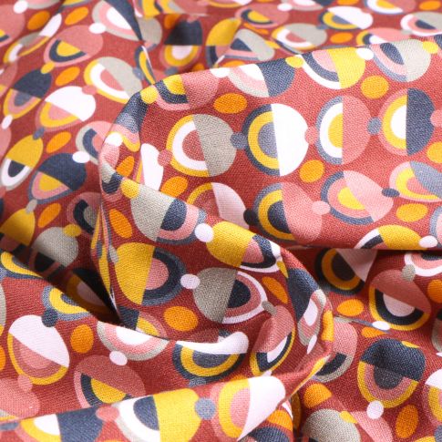 Tissu Coton imprimé Sixta Cercles pop sur fond Terre de Sienne