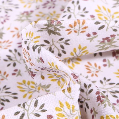 Tissu Coton imprimé Bio Feuillages colorés sur fond Blanc