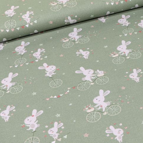 Tissu Coton imprimé Bio Lapins à vélo sur fond Vert amande