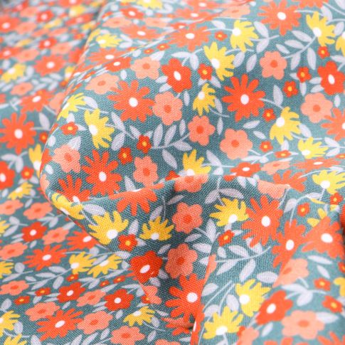 Tissu Coton MC Fabrics Pâquerettes oranges et jaunes sur fond Vert d'eau