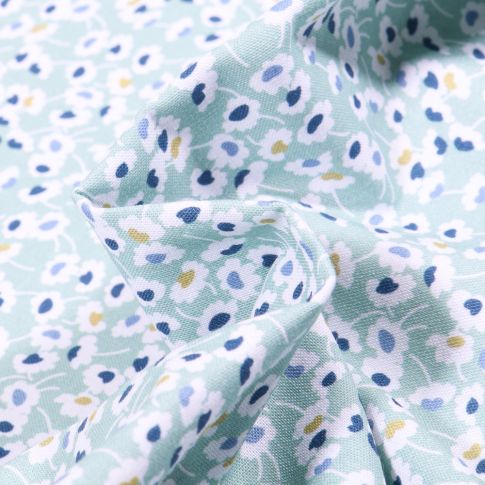 Tissu Coton MC Fabrics Pâquerettes jaunes et bleu sur fond Vert menthe clair