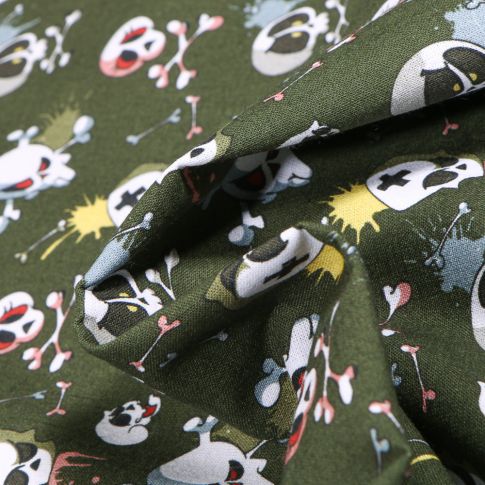 Tissu Coton MC Fabrics Têtes de morts énervés sur fond Vert kaki foncé