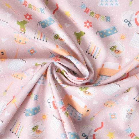 Tissu Coton imprimé Passion créative sur fond Rose pâle