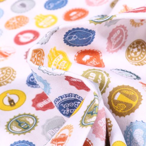 Tissu Coton MC Fabrics Capsules de bières sur fond Blanc