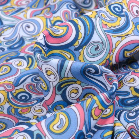 Tissu Lycra maillot de bain Spirales sur fond Bleu ciel