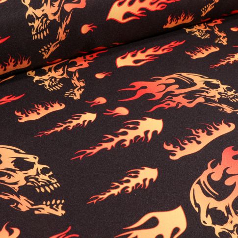 Tissu Burlington Têtes de mort flammes sur fond Noir
