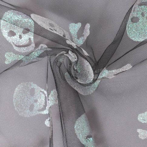 Tissu Tulle souple  Morgana tête de mort paillettes argentés et irisés sur fond Noir