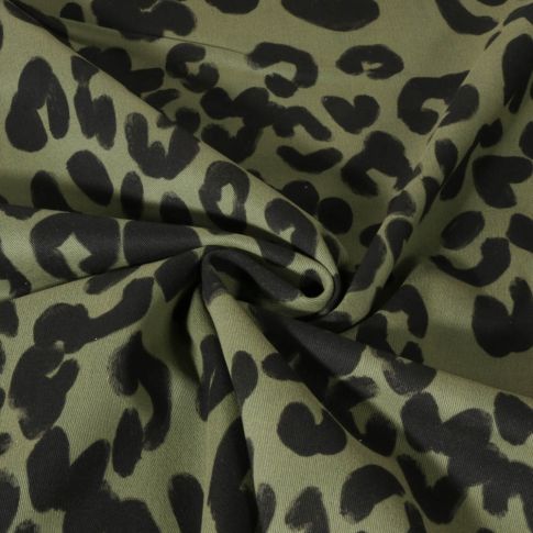 Tissu Coton sergé toucher velouté imprimé léopard noir sur fond Vert kaki