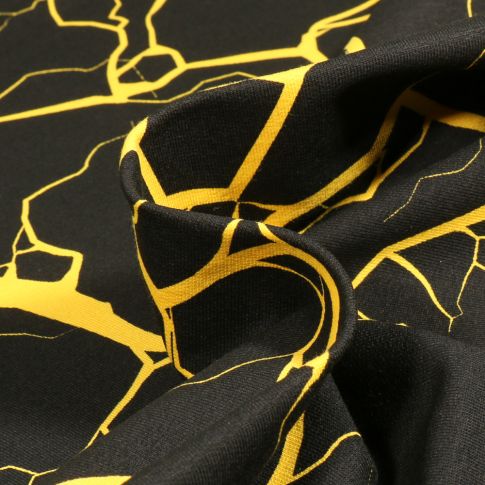 Tissu Jersey Coton Marbre Jaune sur fond Noir