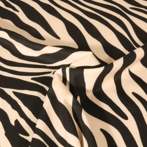 Tissu Lycra imprimé Zébré noir sur fond Ecru