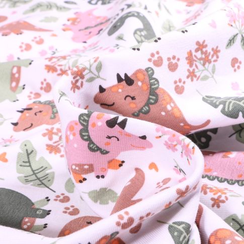 Tissu Jersey Coton Dinosaures mignons et feuilles sur fond Blanc