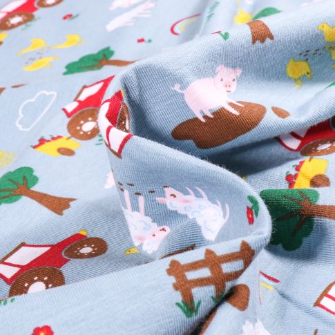 Tissu Jersey Coton Animaux de la ferme et tracteur sur fond Bleu ciel