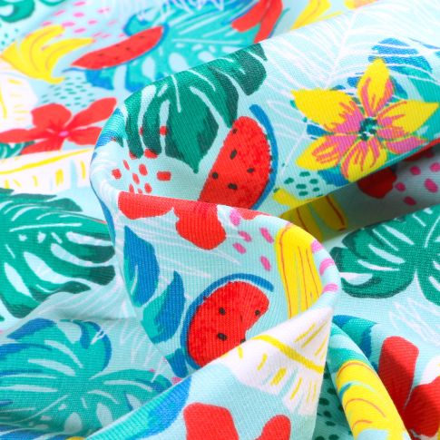 Tissu Jersey Coton Fruits et fleurs tropicales sur fond Bleu turquoise