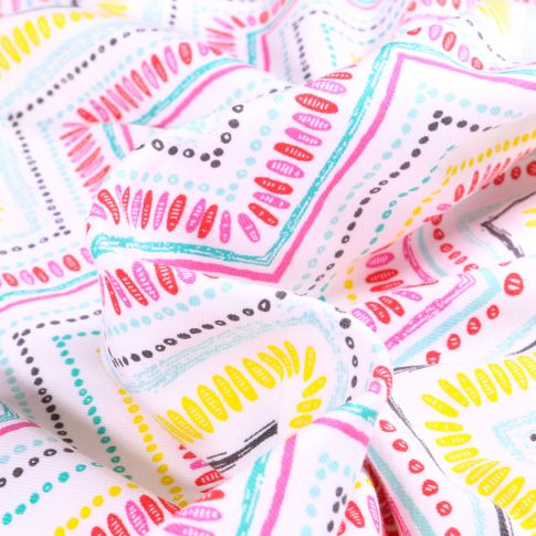Tissu Jersey Coton Chevrons motifs colorés sur fond Blanc