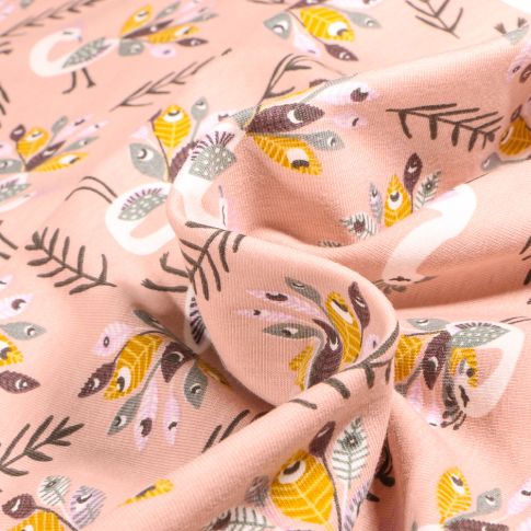 Tissu Jersey Coton Paons et plumes sur fond Rose pâle