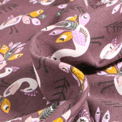 Tissu Jersey Coton Paons et plumes sur fond Lie de vin