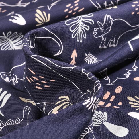 Tissu Jersey Coton Dinosaures et feuillages sur fond Bleu marine