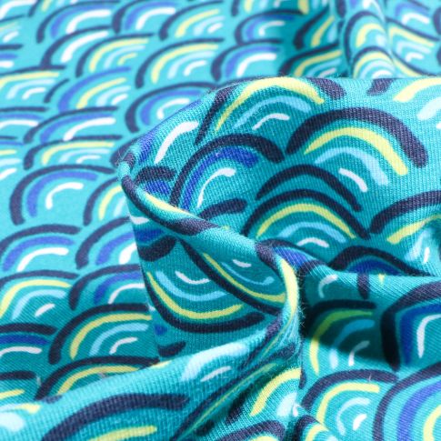 Tissu Jersey Coton Rainbow néon sur fond Bleu turquoise