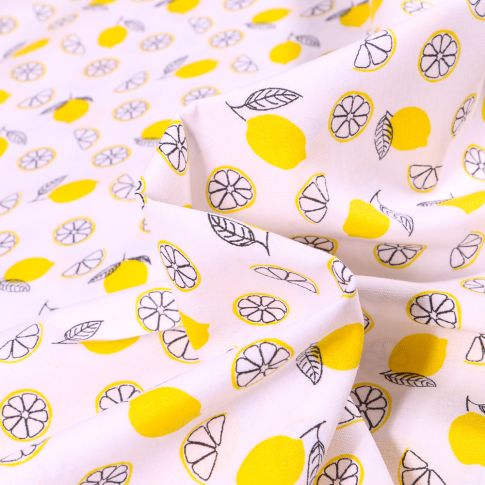 Tissu Coton imprimé Citron tranche sur fond Blanc