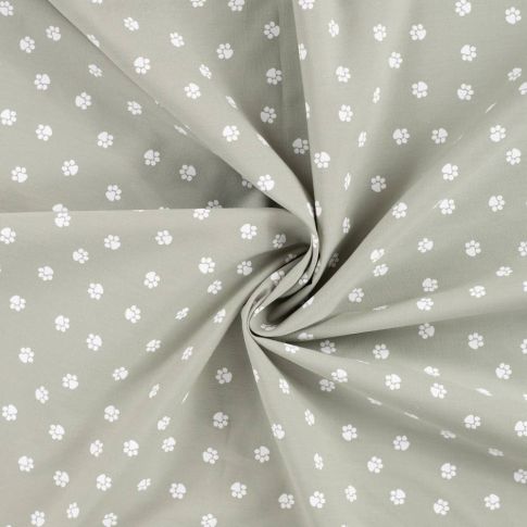 Tissu Popeline de Coton  patounes blanches  Zumi sur fond Vert kaki clair