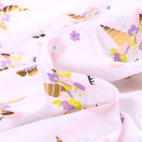 Tissu Jersey Coton Tête de licorne fleuris doré sur fond Blanc