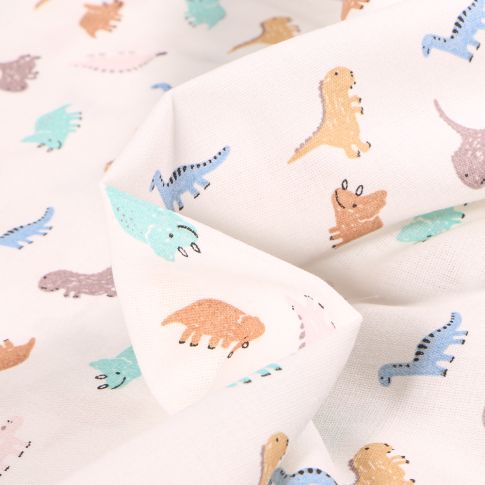 Tissu Coton imprimé Chally Dino multicolores sur fond Blanc cassé