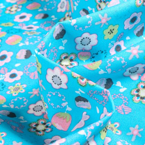 Tissu Coton imprimé Chally Ingrid sur fond Bleu turquoise