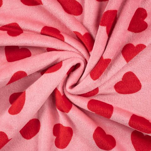 Tissu Doudou imprimé Coeurs rouges sur fond Rose