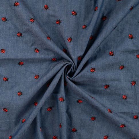 Tissu Chambray Coton Coccinelles brodées rouges sur fond Bleu jean