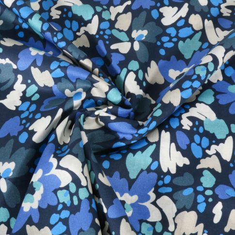 Tissu Voile de Coton digital Fleurs colorées bleues et écrues sur fond Bleu marine