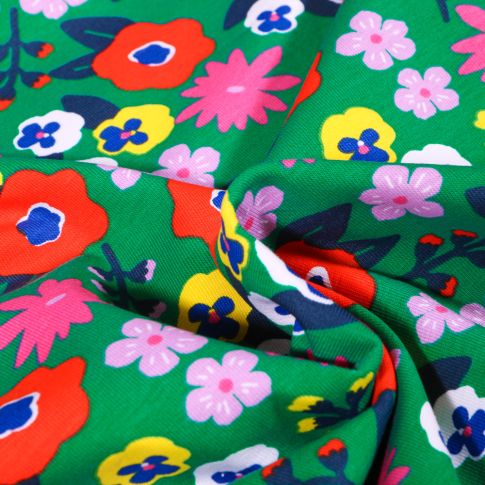 Tissu Jersey Coton Fleurs seventies vitaminés sur fond Vert vif