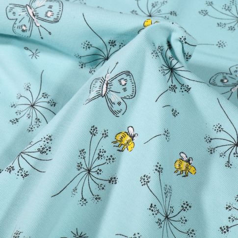 Tissu Jersey Coton Pissenlit et papillons sur fond Bleu ciel
